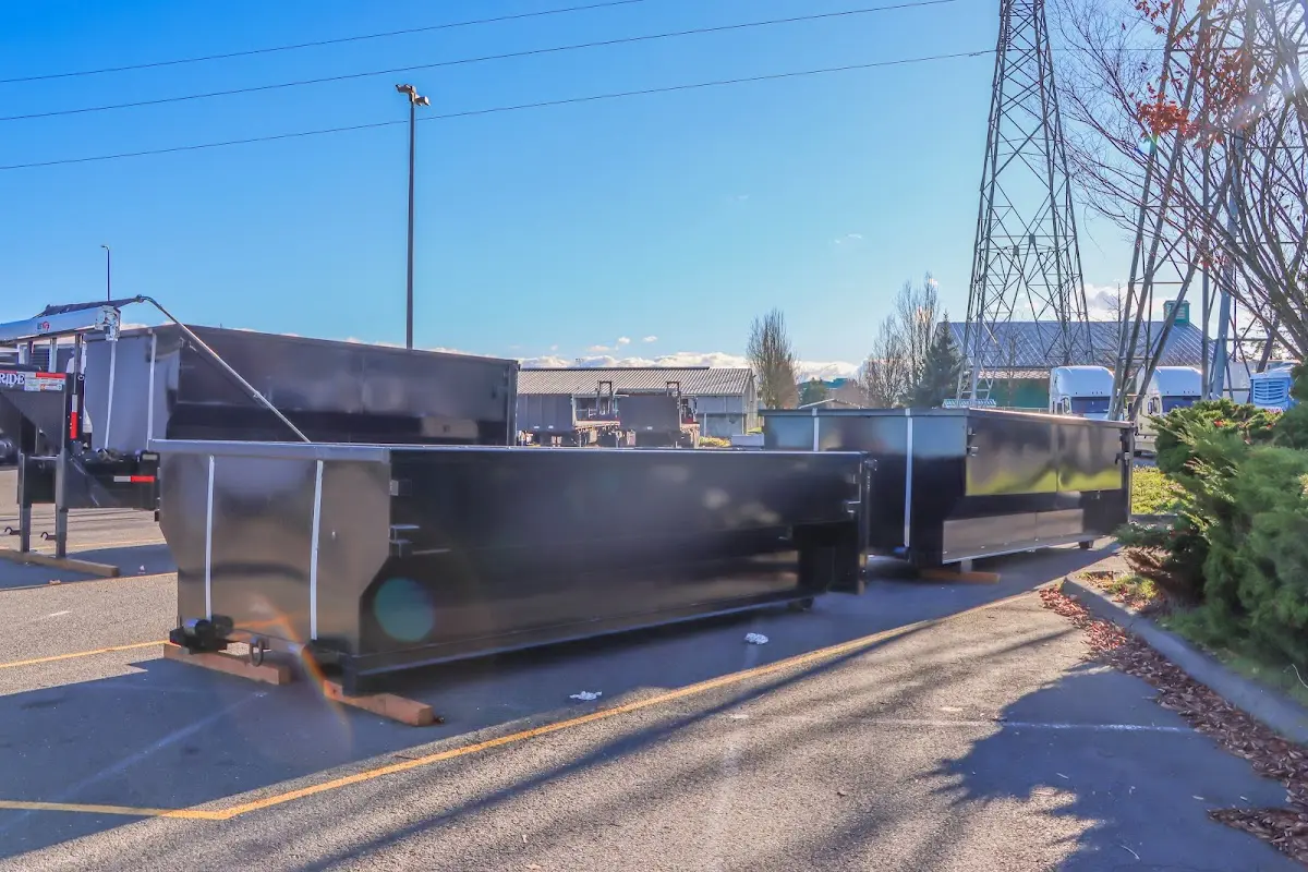Roll-off dumpster ready for waste disposal at job site for Concrete Dumpster Rental in Pelham Manor